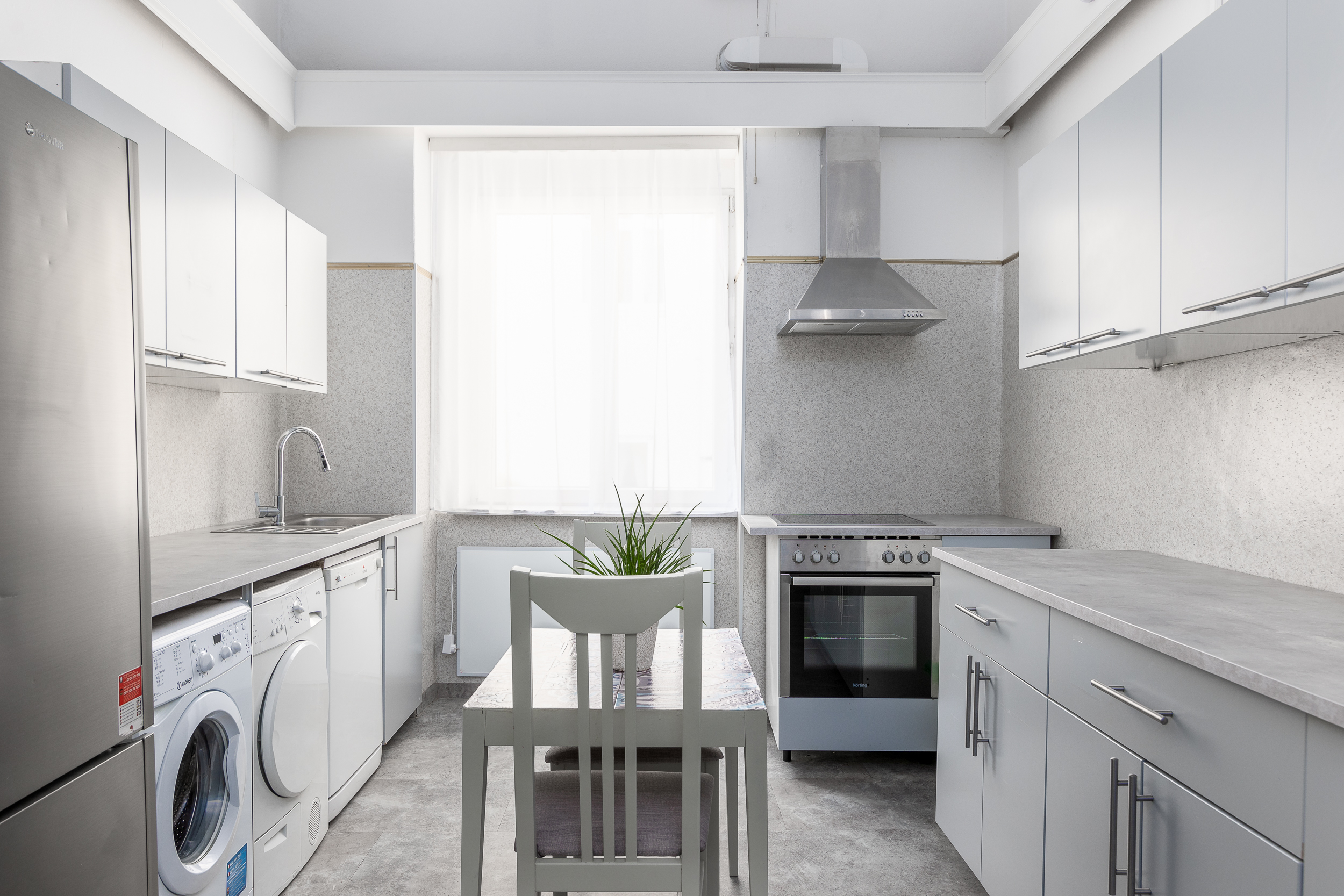 Hotel Zentral guest laundry room and kitchenette