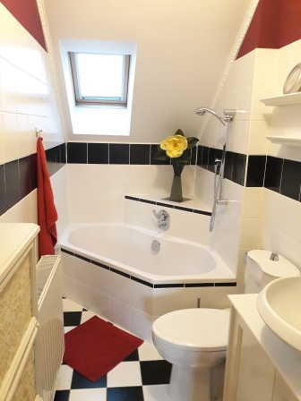 Bathroom with corner bath